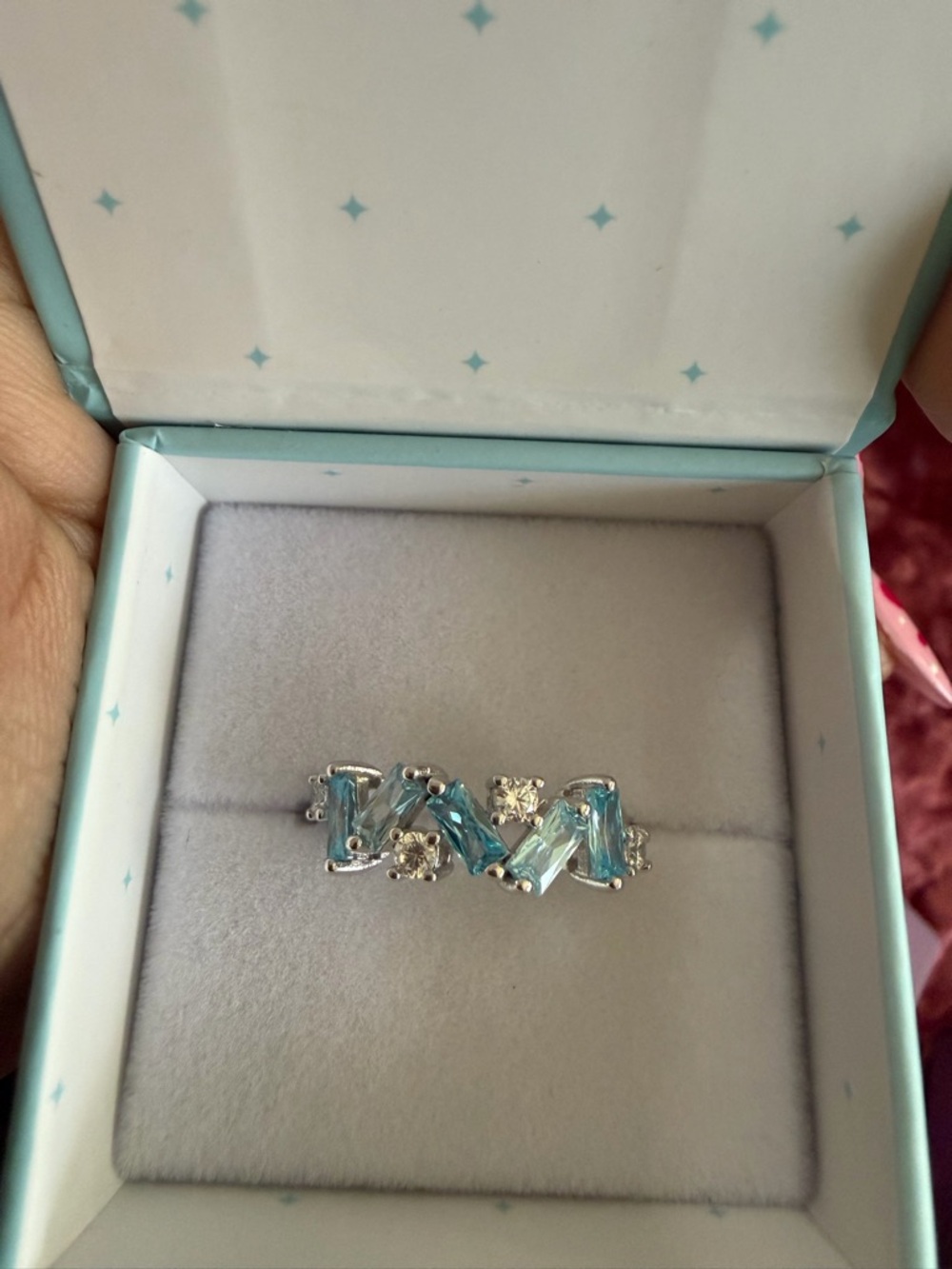 Icebreaker Silver Ring with Light Blue Topaz and White Accents